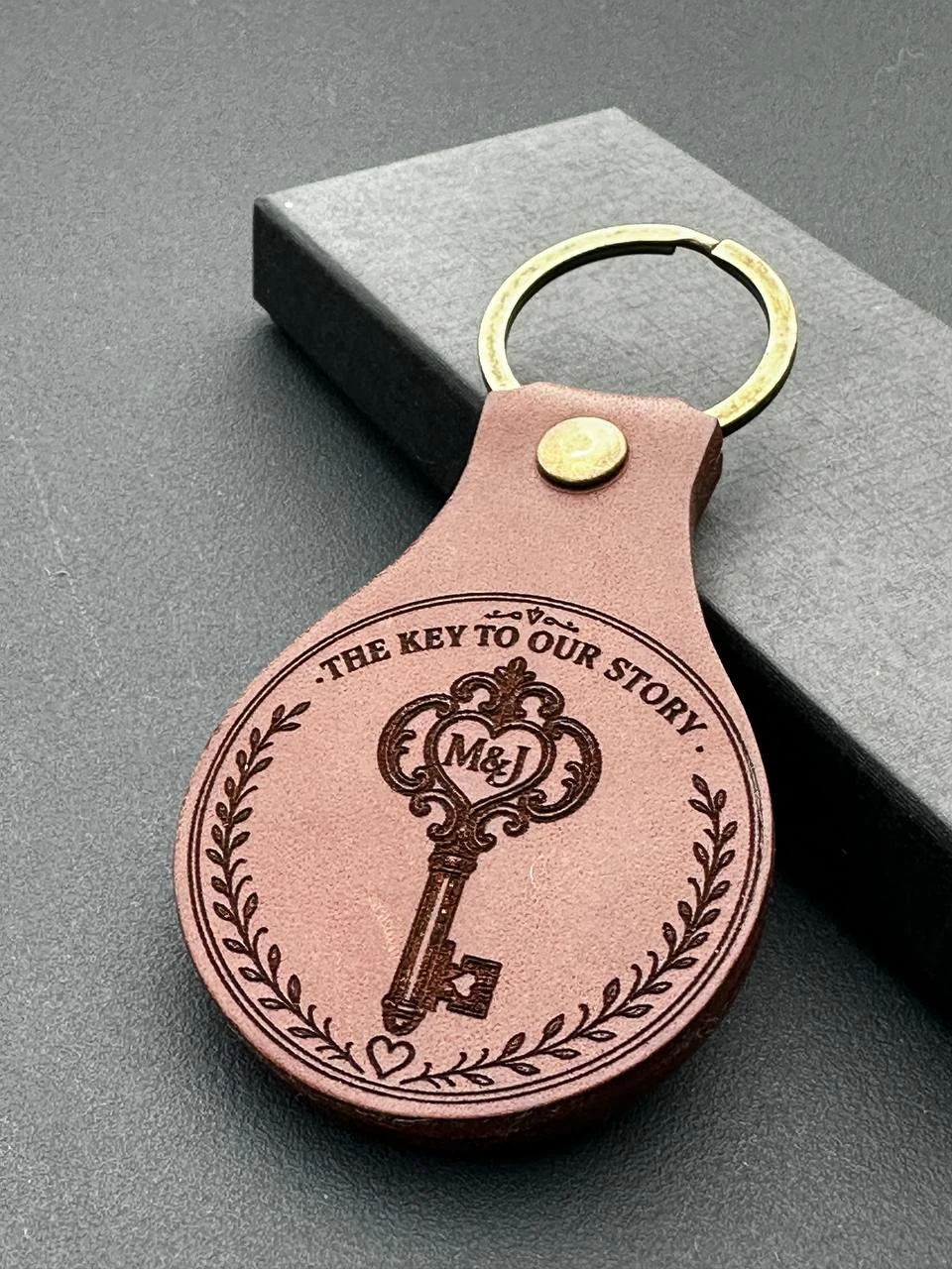 Personal engraving on a round leather keyring